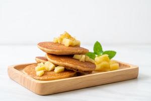 Apple pancake or apple crepe with cinnamon powder photo