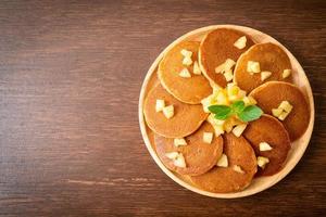 Apple pancake or apple crepe with cinnamon powder photo