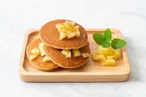 Apple pancake or apple crepe with cinnamon powder photo