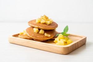 Apple pancake or apple crepe with cinnamon powder photo