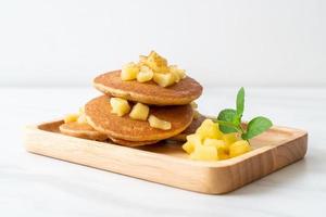 Apple pancake or apple crepe with cinnamon powder photo