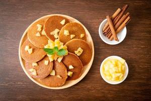 Apple pancake or apple crepe with cinnamon powder photo