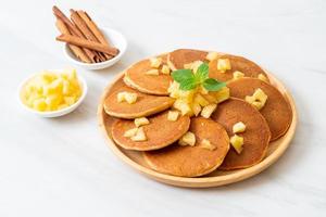 Apple pancake or apple crepe with cinnamon powder