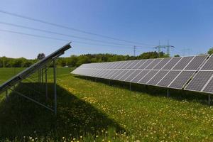 Solar Power Station on the summer flowering Meadow photo