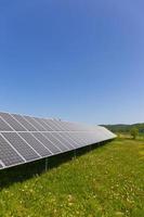 Solar Power Station on the summer flowering Meadow photo
