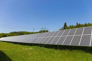 Solar Power Station on the summer flowering Meadow photo