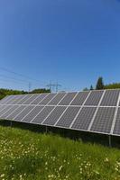 Solar Power Station on the summer flowering Meadow photo