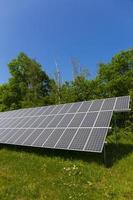 Solar Power Station on the summer flowering Meadow photo