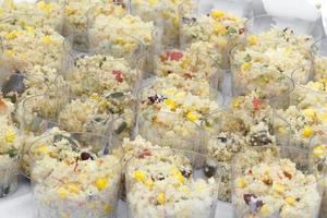 Vegetables couscous served in plastic cups