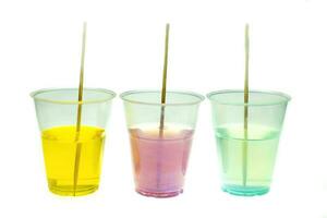 Mixing color epoxy resin in plastic cup for casting Stabilizing wood and pine cone hybrid at white background photo