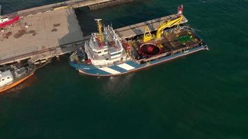 Flying over the marina and cargo port for ships in the sea Aerial shot video