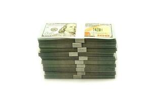 Stack bundles of 100 US dollars banknotes on white background photo