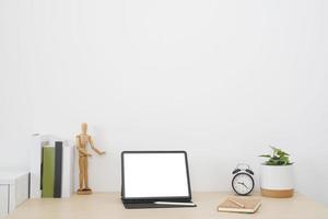 Blank screen tablet with digital pencil on the table. photo