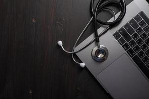 Stethoscope on desk with books photo