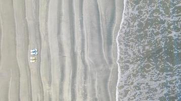 Flip-Flops on Sand beach, Summer holiday background, Aerial top view photo