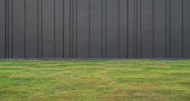 Green grass and black wall background photo