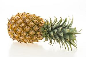 Pineapple fruit on white photo