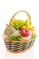 Fruits basket on white photo