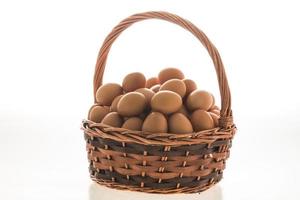 Eggs basket on white photo