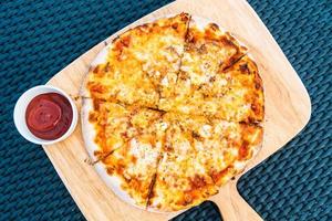 Seafood pizza on wood tray photo