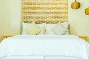 Pillow on bed decoration in bedroom interior photo