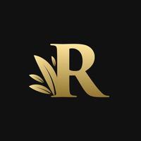 logotipo de la hoja de la letra r inicial dorada