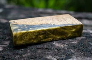 Casting epoxy resin maple burl wood on the table photo