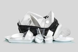 Group of Products made of plastic and foam in garbage bags photo