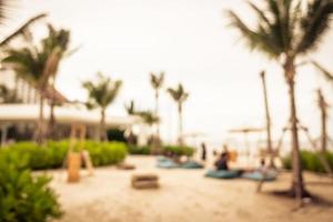 Abstract blur and defocused palm tree with beach and sea photo