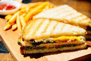 Club sandwich with french fries photo