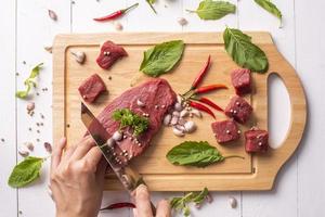 Raw beef on white wood background photo