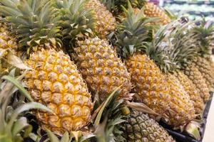 Pineapples in supermarket photo