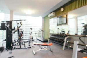 Abstract blur fitness equipment in gym photo