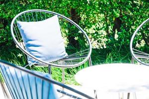 Patio with Pillow on chair and table set photo