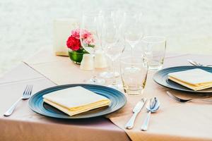 Romantic dining table setting with wine glass and other photo