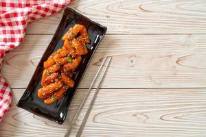 Deep-fried Korean rice cake, or Tteokbokki, with spicy sauce - Korean food style photo