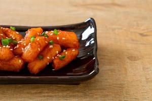 Deep-fried Korean rice cake, or Tteokbokki, with spicy sauce - Korean food style photo