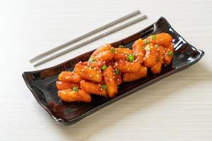 Deep-fried Korean rice cake, or Tteokbokki, with spicy sauce - Korean food style photo