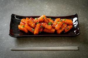 Deep-fried Korean rice cake, or Tteokbokki, with spicy sauce - Korean food style photo