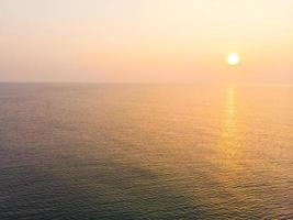 Aerial view sunrise with sea photo