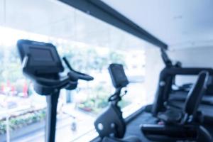 Abstract blur defocused fitness equipment and gym interior photo