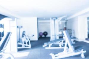 Abstract blur defocused fitness equipment and gym interior photo