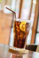 Cola glass with lemon photo