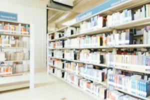 Abstract blur and defocused bookshelf in library photo