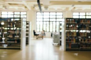 Abstract blur and defocused bookshelf in library photo