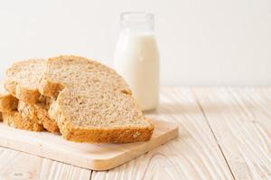 Sliced wholegrain bread on a wooden table photo