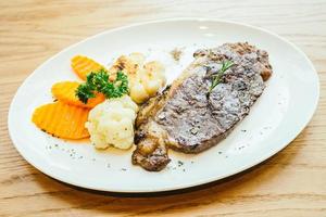 Grilled beef meat steak with vegetable photo