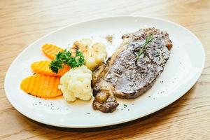 Grilled beef meat steak with vegetable photo