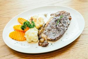 Grilled beef meat steak with vegetable photo