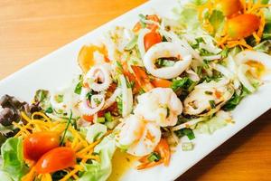 Mixed spicy seafood salad with thai style photo